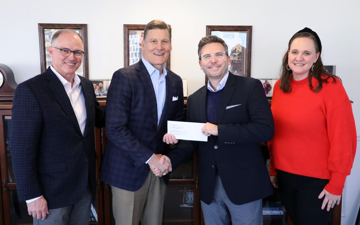Picture of Dr. Hance Dilbeck and David Spika giving a check to members of the Psalm 139 Project